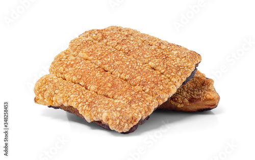 Close up view of crispy pork belly or deep fried pork isolated on white background with clipping path.