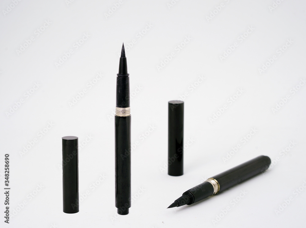 eyeliner with caps on isolated white background eyeliner with caps on isolated white background