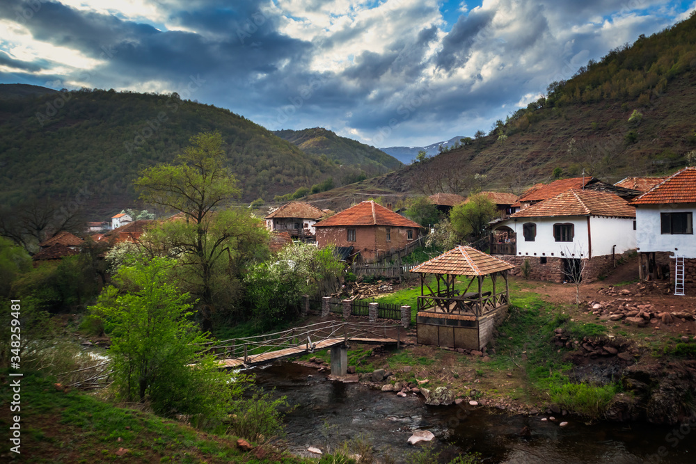 Old rustic idyllic houses in a village Topli do on Old Mountain (stara planina) in Serbia