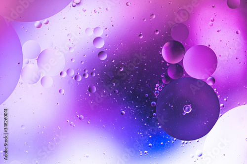 oil drops on water with coloured background 
