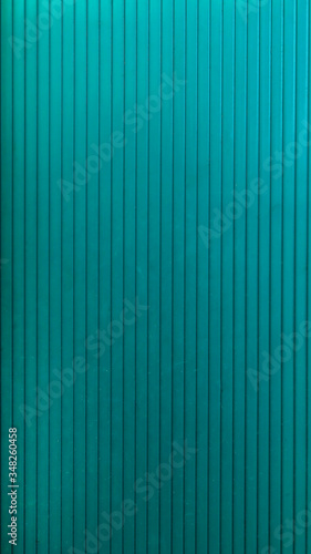 turquoise striped metal surface close up