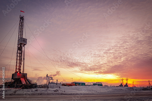 Oil and Gas Drilling Rig. Oil drilling rig operation on the platform in oil and gas industry. Global coronavirus COVID 19 crisis. Petroleum concept. War on oil prices. Environmental pollution.