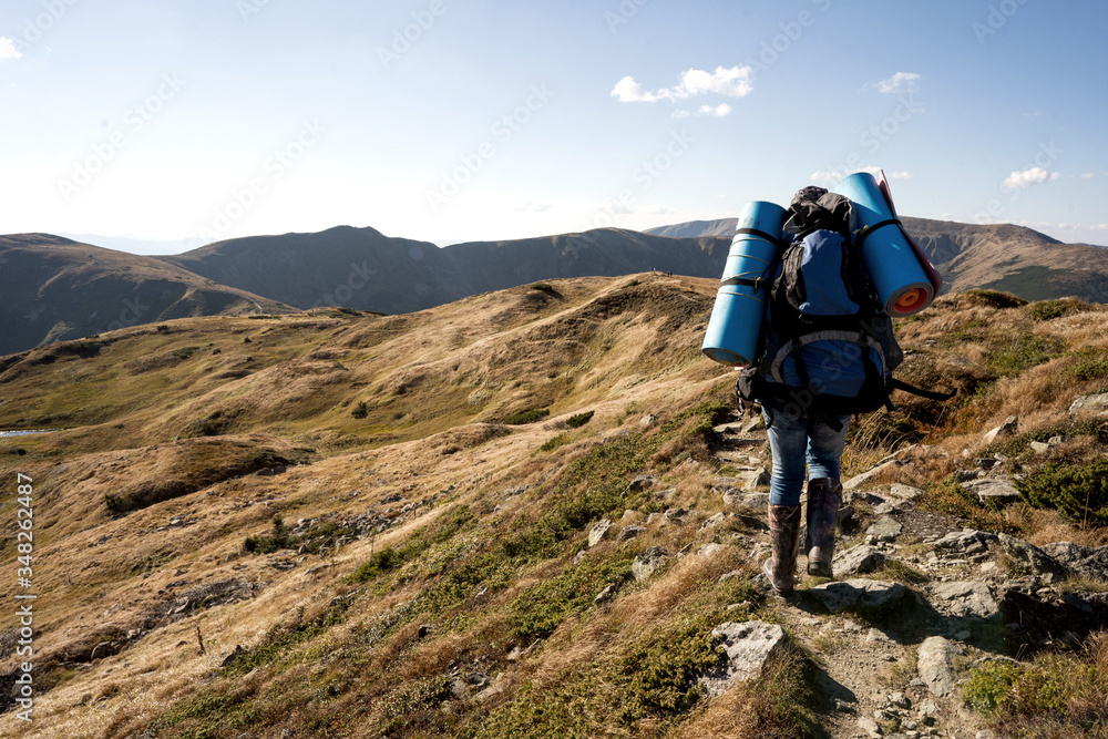 hiker in the mountains with backpacks