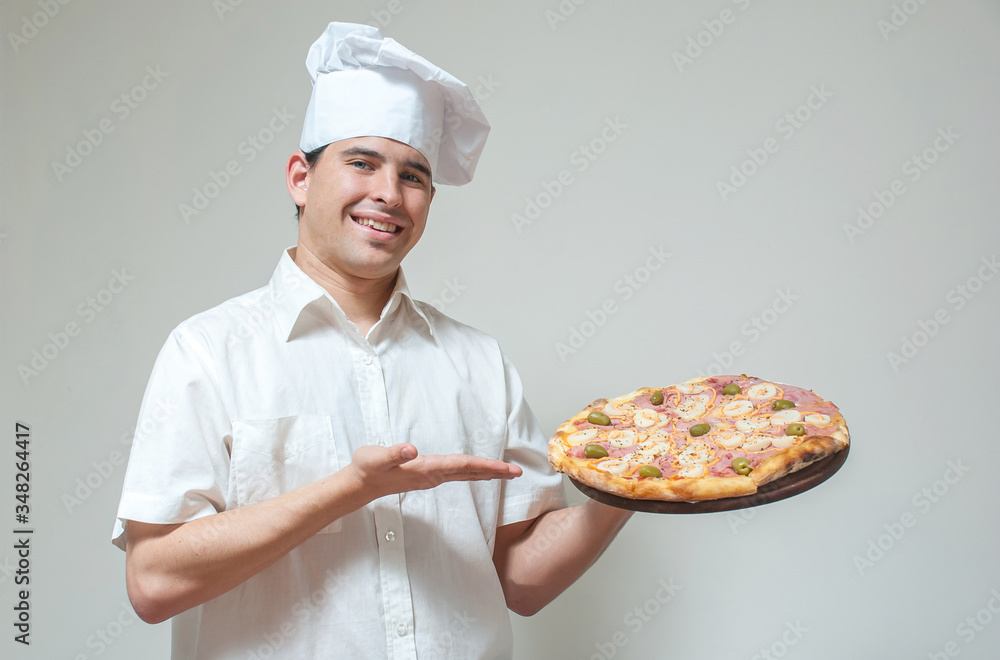portrait cook with pizza on a light background portrait cook with pizza on a light background