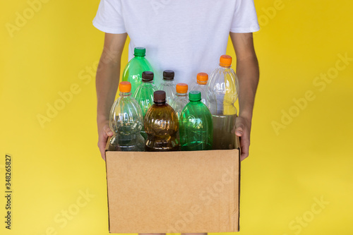 Plastic bottles at cardboard box photo