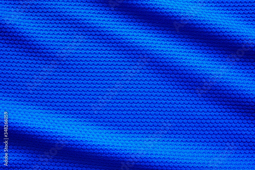 Blue football jersey clothing fabric texture sports wear background, close up top view