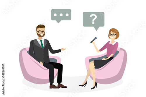 Beautiful caucasian woman reporter interviews handsome businessman. People sitting in armchairs.