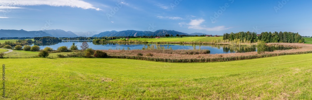 panoramic scene in Bavaria with lake and mountain range