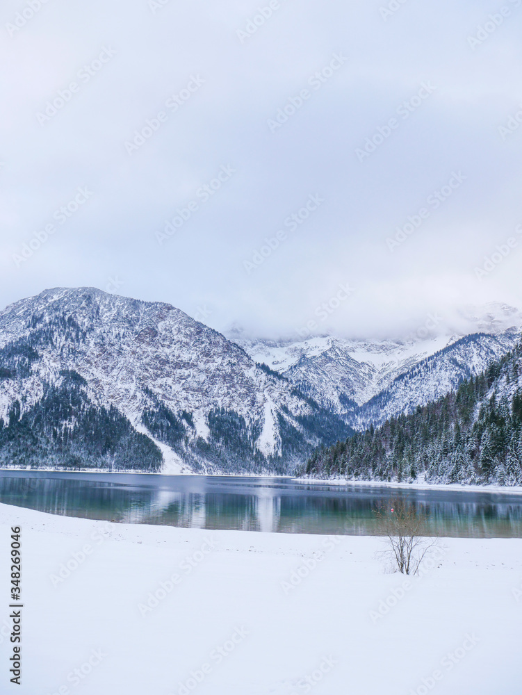 winter on lake plansee austria foggy mountains snow lake