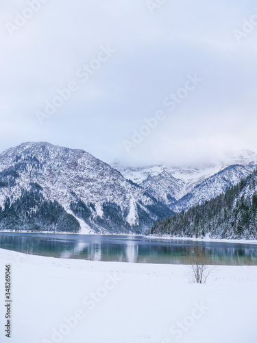 winter on lake plansee austria foggy mountains snow lake © Pat Whelen