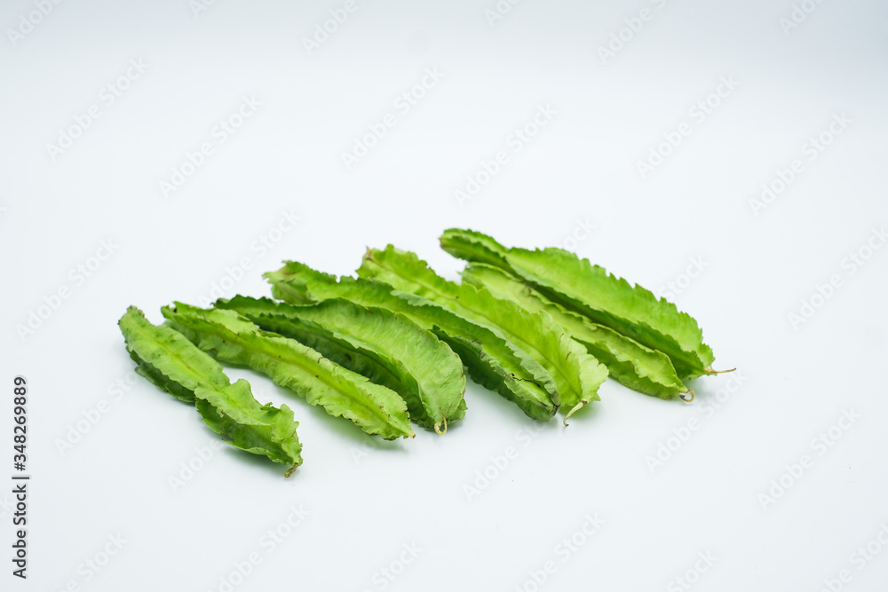 The winged bean , Psophocarpus tetragonolobus,shot in a white isolated background The winged bean , Psophocarpus tetragonolobus,shot in a white isolated background