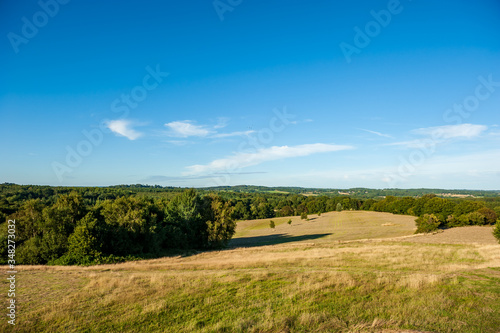 Fields and meadows around Herstmonceux, East Sussex, England. Brick Herstmonceux castle in England (East Sussex) 15th century.