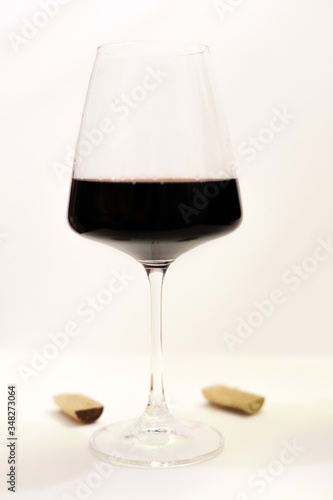 beautiful isolated glass of red wine on a white background