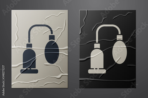 White Penis pump icon isolated on crumpled paper background. Penis enlarger. Sex toy for men. Vacuum pump with a blower to increase the penis. Paper art style. Vector