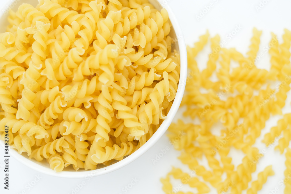 Twisted macaroni shot on a white isolated background. Twisted macaroni shot on a white isolated background.