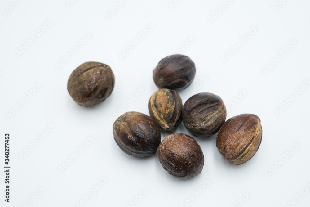 Buah pala or nutmeg shot on a white isolated background. Buah pala or nutmeg shot on a white isolated background.
