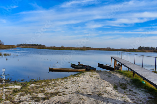 Wallpaper Mural Wooden pier on the lake with boats Torontodigital.ca