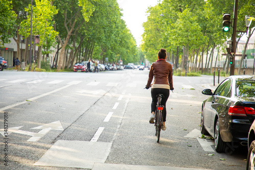 young woman riding a bike © Chouk