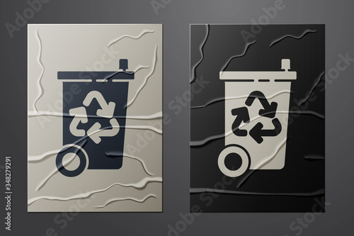 White Recycle bin with recycle symbol icon isolated on crumpled paper background. Trash can icon. Garbage bin sign. Recycle basket sign. Paper art style. Vector