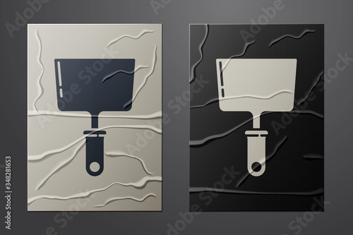 White Putty knife icon isolated on crumpled paper background. Spatula repair tool. Spackling or paint instruments. Paper art style. Vector