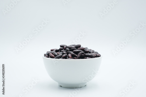 Red Kidney Bean or Phaseolus vulgaris shot on a white isolated background.