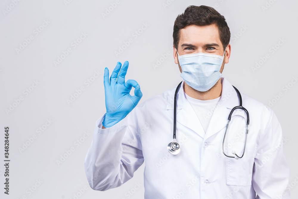 Doctor Wearing Gloves and Medical Mask. Medical Concept Corona Virus. Ok sign.