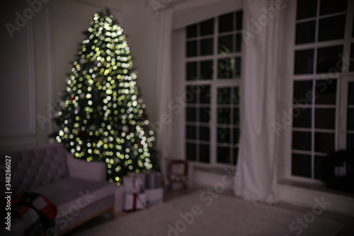Blurred view of modern living room with Christmas tree
