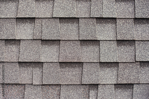 Gray shingles for covering the roof. Building material flexible tile background. photo