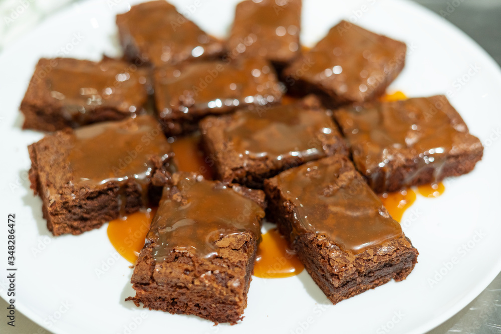 Close-up on white plate with freshly baked brownie Close-up on white plate with freshly baked brownie