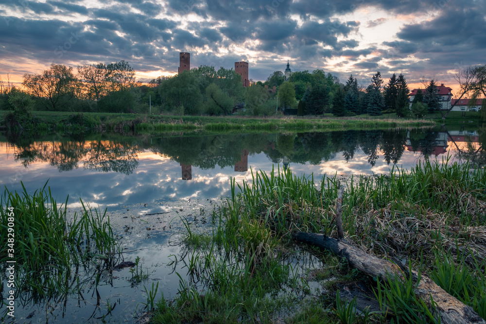 Castle and Czerskie lake at sunset in Czersk, Poland