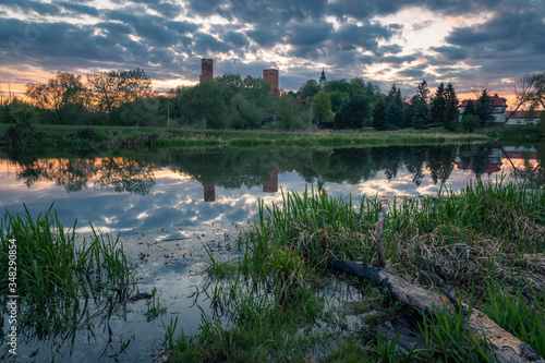 Obraz na płótnie Castle and Czerskie lake at sunset in Czersk, Poland w salonie