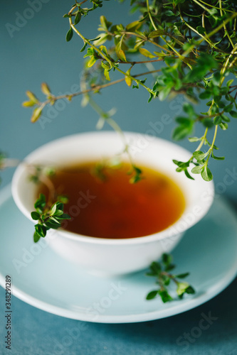 Herbal tea with fresh sprigs of thyme