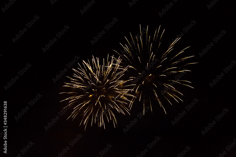 Beautiful white and yellow firework isolated closeup Beautiful white and yellow firework isolated closeup