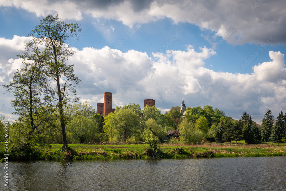Castle and Czerskie lake at sunny spring day in Czersk, Poland