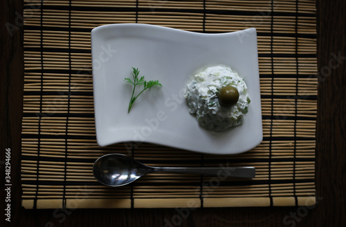 Mediterranean dill salad on a wooden table photo