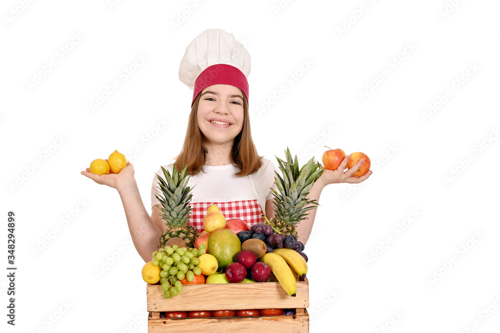female cook with lemons apples and different fruit in wooden crate female cook with lemons apples and different fruit in wooden crate