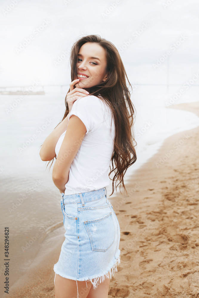 Young beautiful happy woman is relaxing on beach Young beautiful happy woman is relaxing on beach