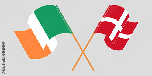 Crossed and waving flags of Ireland and Denmark
