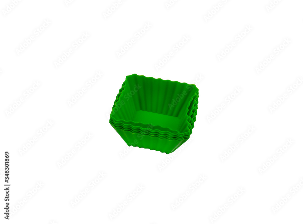 Isolated silicone cupcake molds on a white background. Baking and omelet forms. Isolated silicone cupcake molds on a white background. Baking and omelet forms.
