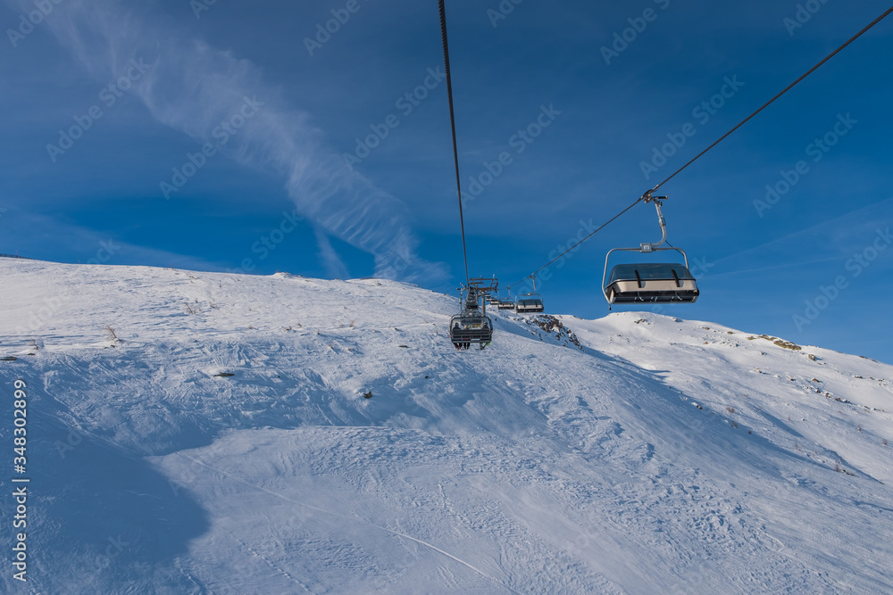 Obraz premium Ski slope in winter at Grosseck-Speiereck resort, Mauterndorf and S.Martin area, Austria. January 2020