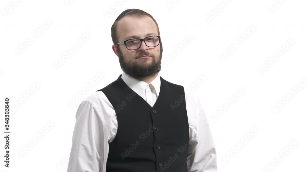 Disappointed Jewish guy showing his thumb down. True emotions expression, gestures concept. Isolated, on white background Disappointed Jewish guy showing his thumb down. True emotions expression, gestures concept. Isolated, on white background
