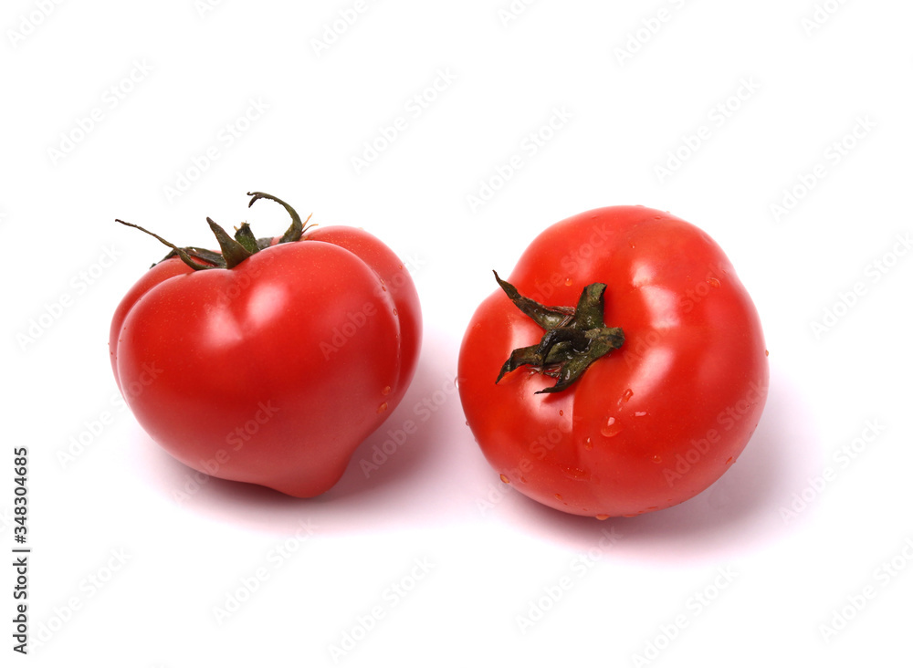 red tomatoes on white background. isolated. close up shot red tomatoes on white background. isolated. close up shot