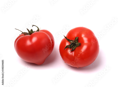 red tomatoes on white background. isolated.  close up shot