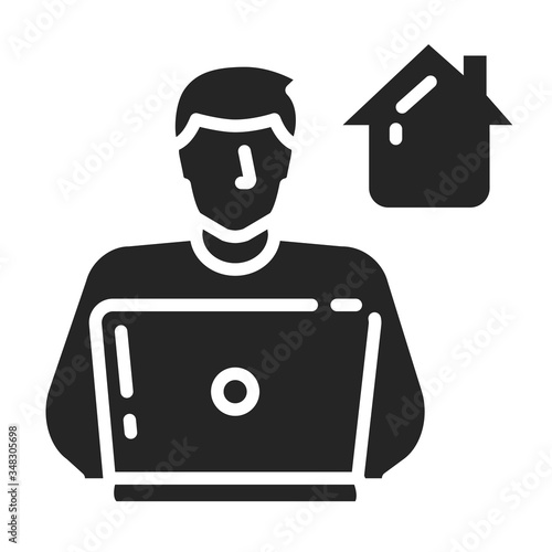 Freelancer man works on laptop black glyph icon. Remote work. Quarantine period. Coronavirus prevention. Pictogram for web page, mobile app, promo