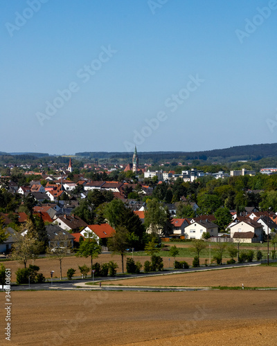 Neumarkt in der Oberpfalz, Bavaria / Germany - May 06 2020. View on the city of Neumarkt in der Oberpfalz from the surrounding hill. photo