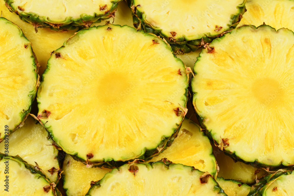 Pineapple juicy yellow slices background. Top view. Pineapple juicy yellow slices background. Top view.