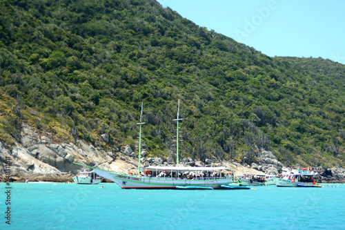 Blue sea in Brazilian tropical paradise  Arraial do Cabo. With boats in the background