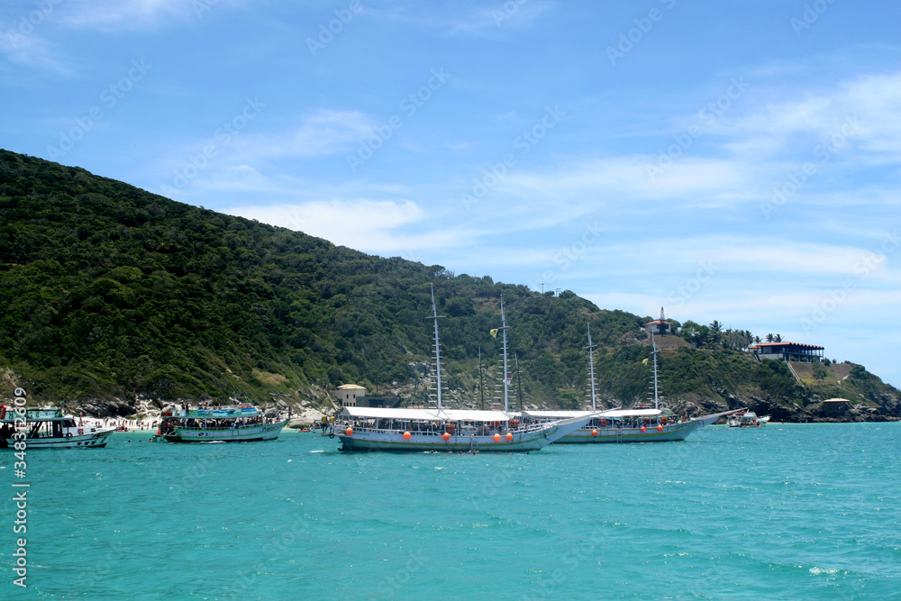 Blue sea in Brazilian tropical paradise, Arraial do Cabo. With boats in the background