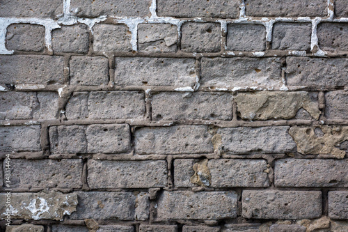  Old gray brick wall background or texture, close up.