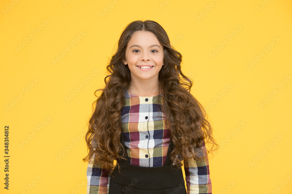 I feel beautiful today. Beauty look of little schoolchild. Happy girl with school look. Small kid wear uniform yellow background. Vogue look. Back to school fashion. Hair salon. Born to be real I feel beautiful today. Beauty look of little schoolchild. Happy girl with school look. Small kid wear uniform yellow background. Vogue look. Back to school fashion. Hair salon. Born to be real